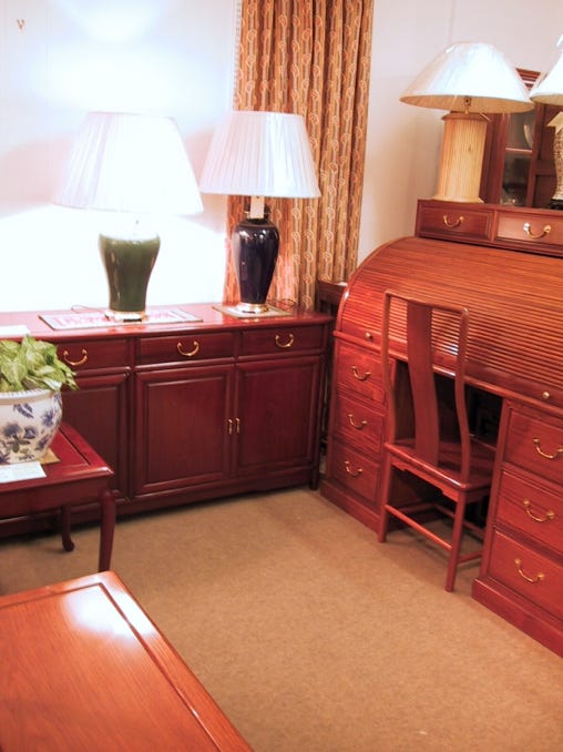 Solid rosewood rolltop desk with 5 drawers and 2 file drawers.
